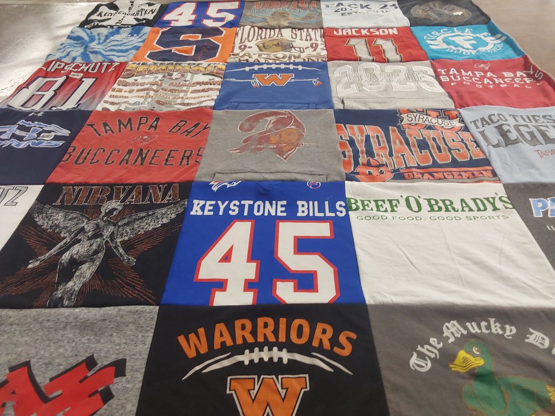 T-shirt quilt featuring tampa bay buccaneers, keystone college warriors by Lauren from CA