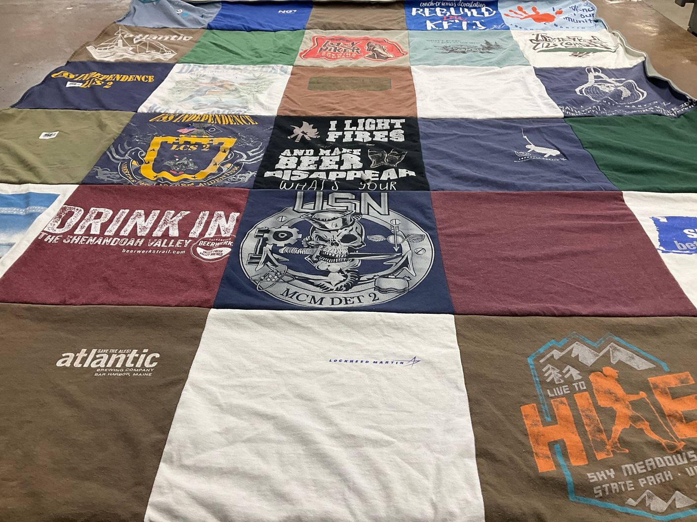 T-shirt quilt with brewing, outdoors themes by Kathleen from FL
