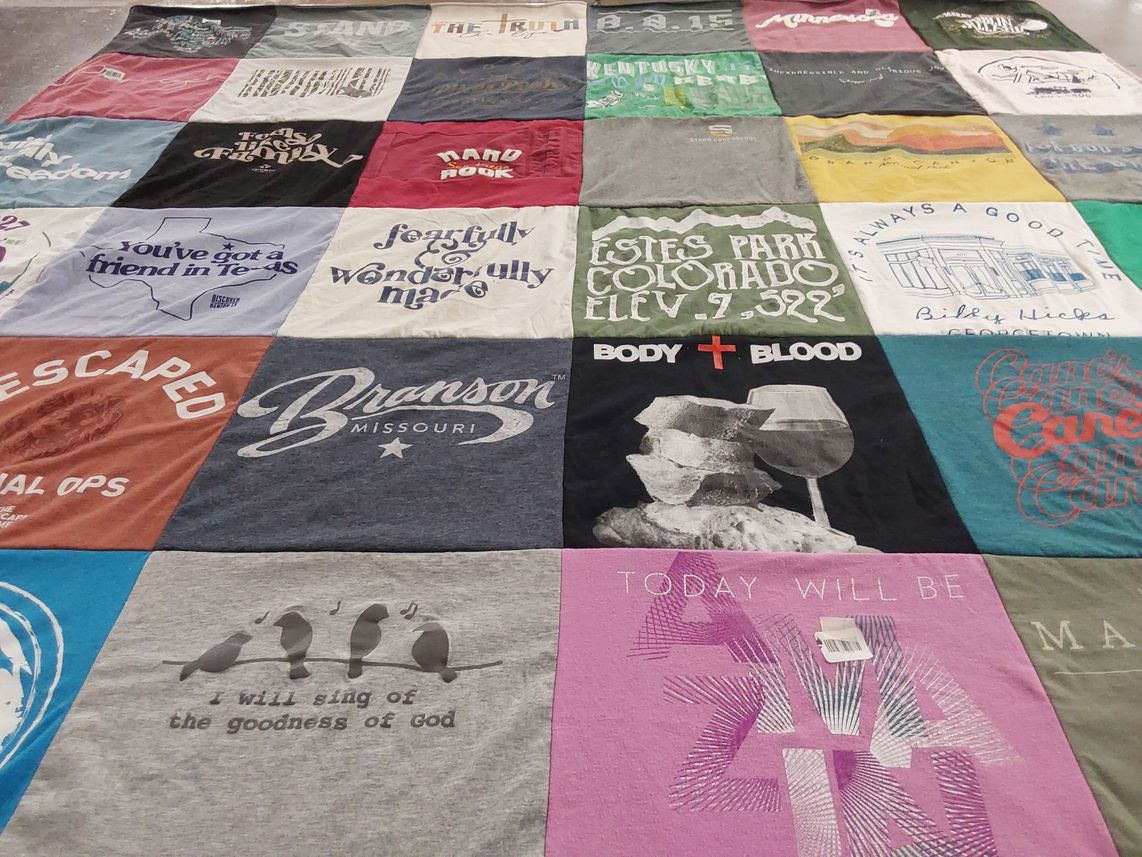 T-shirt quilt with travel, music themes by Chrysta from DC