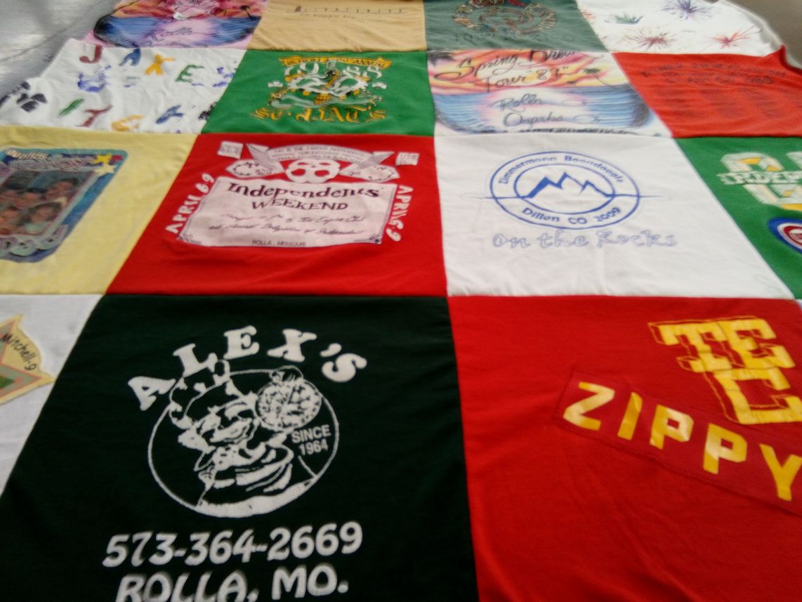 T-shirt quilt with community events, local businesses themes by Susan from MO