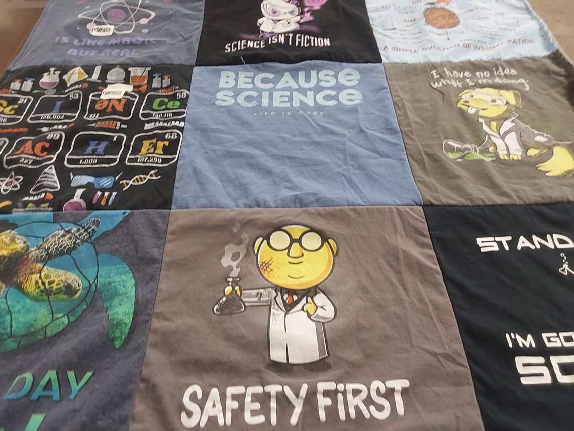 T-shirt quilt with science themes by Kristy from CO