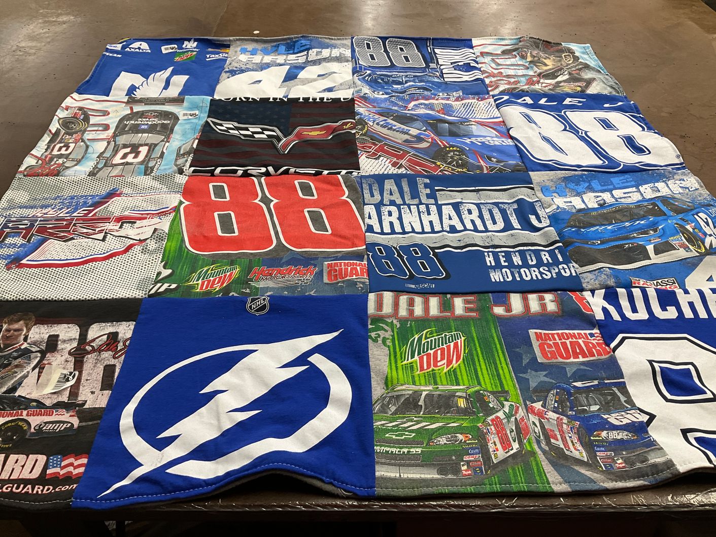 T-shirt quilt with nascar, auto racing themes by Anne from FL