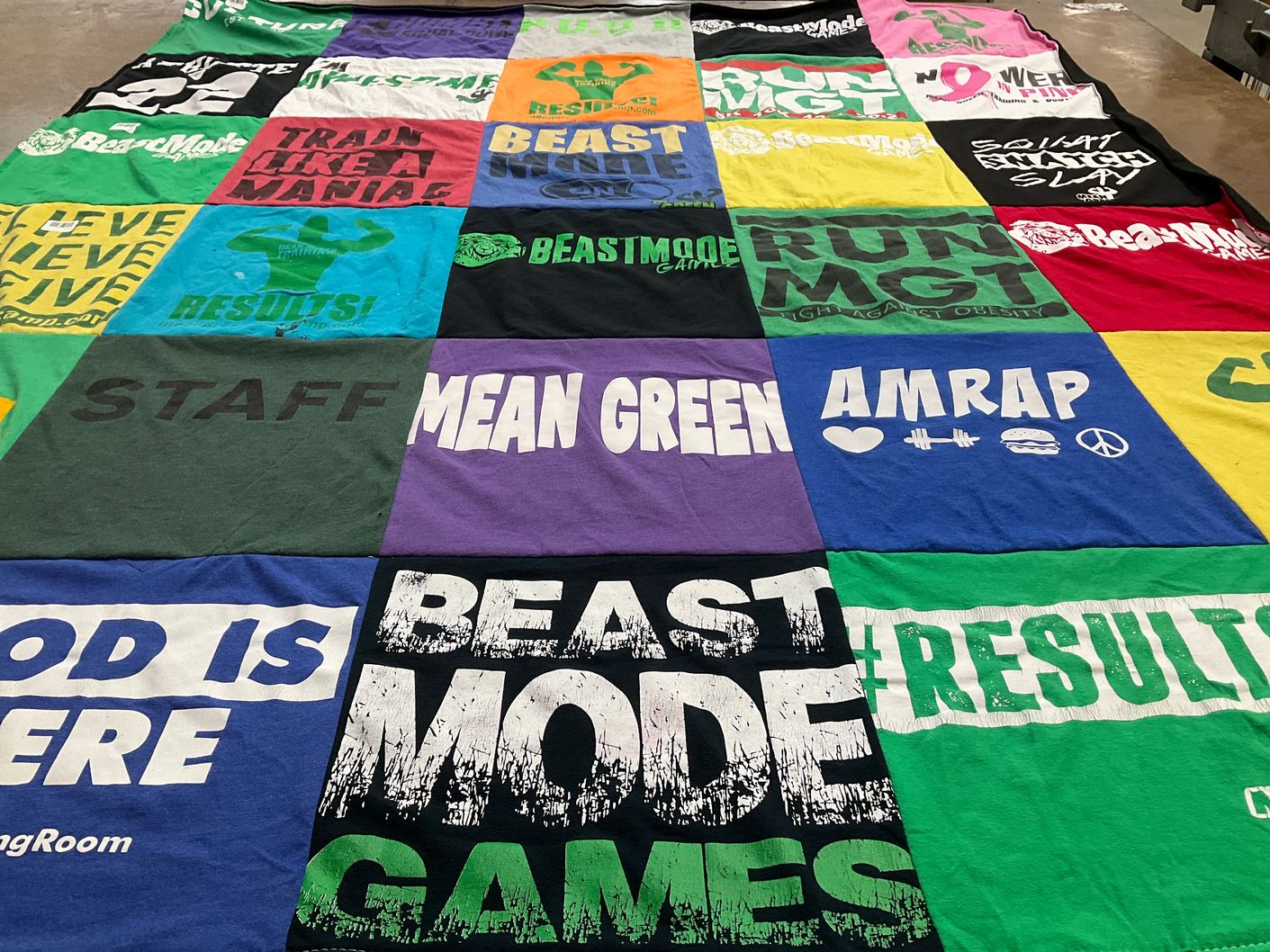 T-shirt quilt with fitness, weightlifting themes by Erica from TX