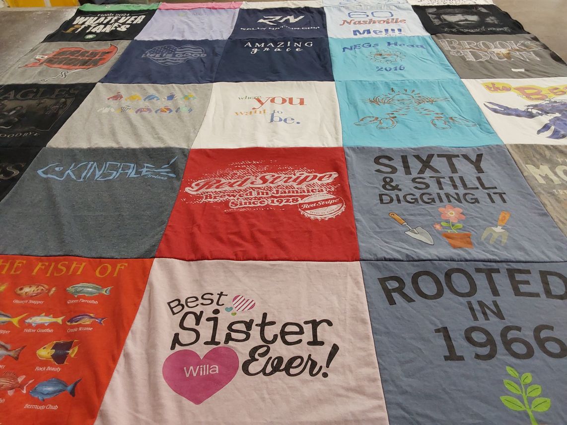 T-shirt quilt with fishing themes by Linda from MA