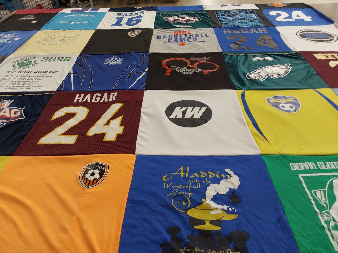 T-shirt quilt with sports, film themes by Jennifer from WA