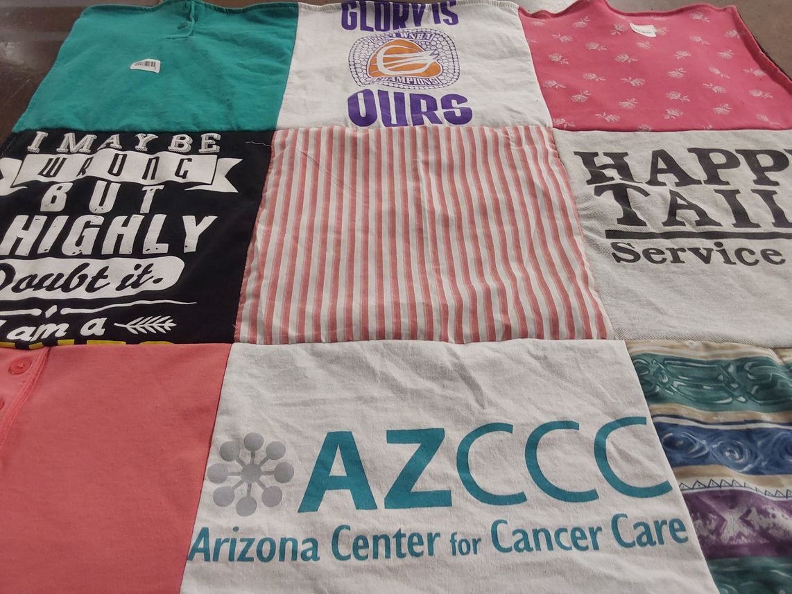 T-shirt quilt with cancer care, community service themes by Carlie from AZ