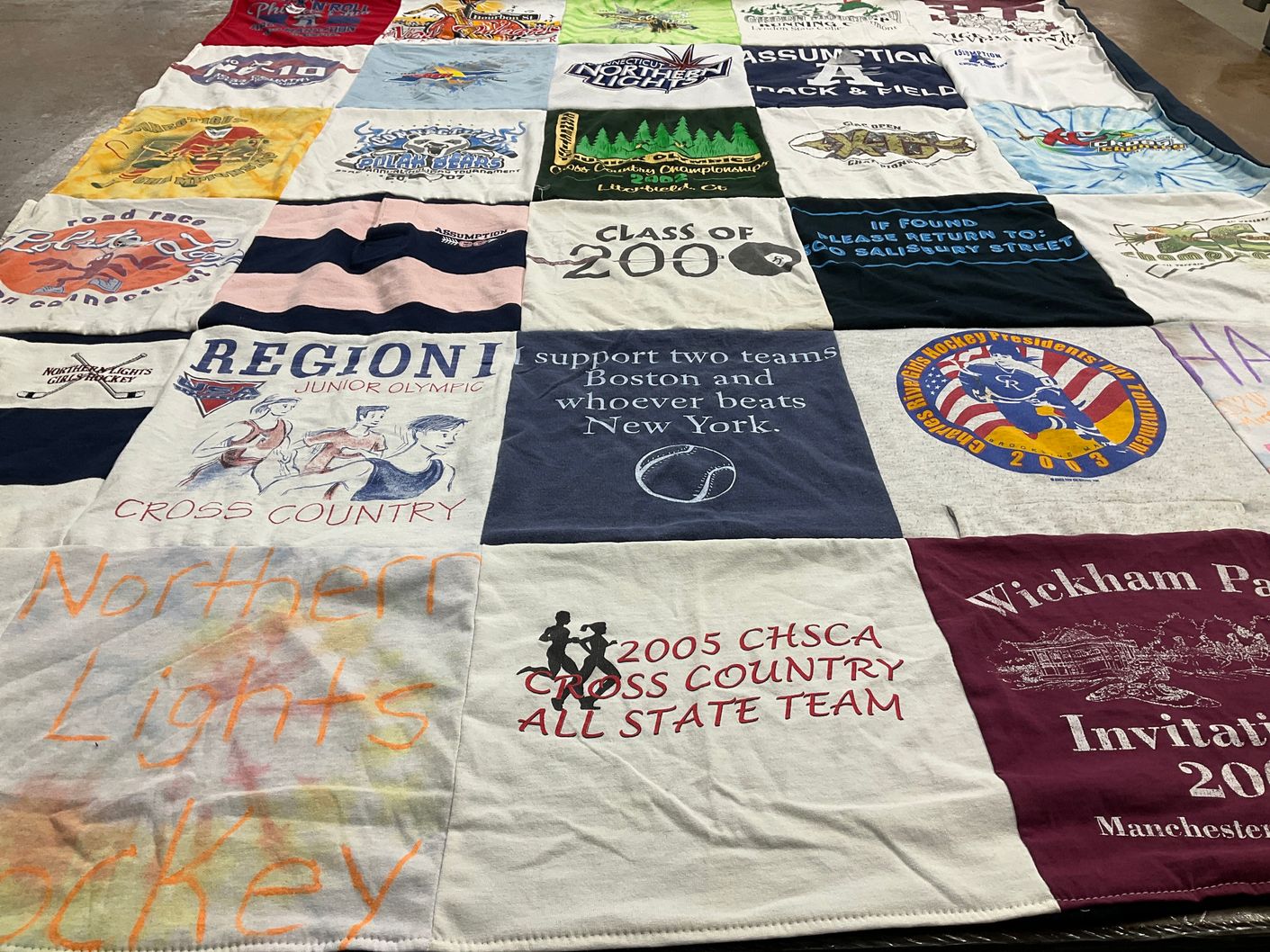 T-shirt quilt featuring northern lights hockey by Rosalinda from RI