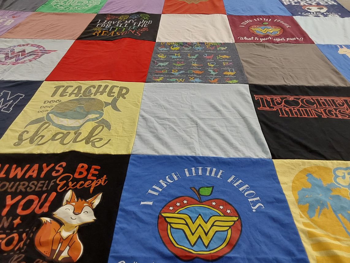 T-shirt quilt with teaching, education themes by Alma from CA
