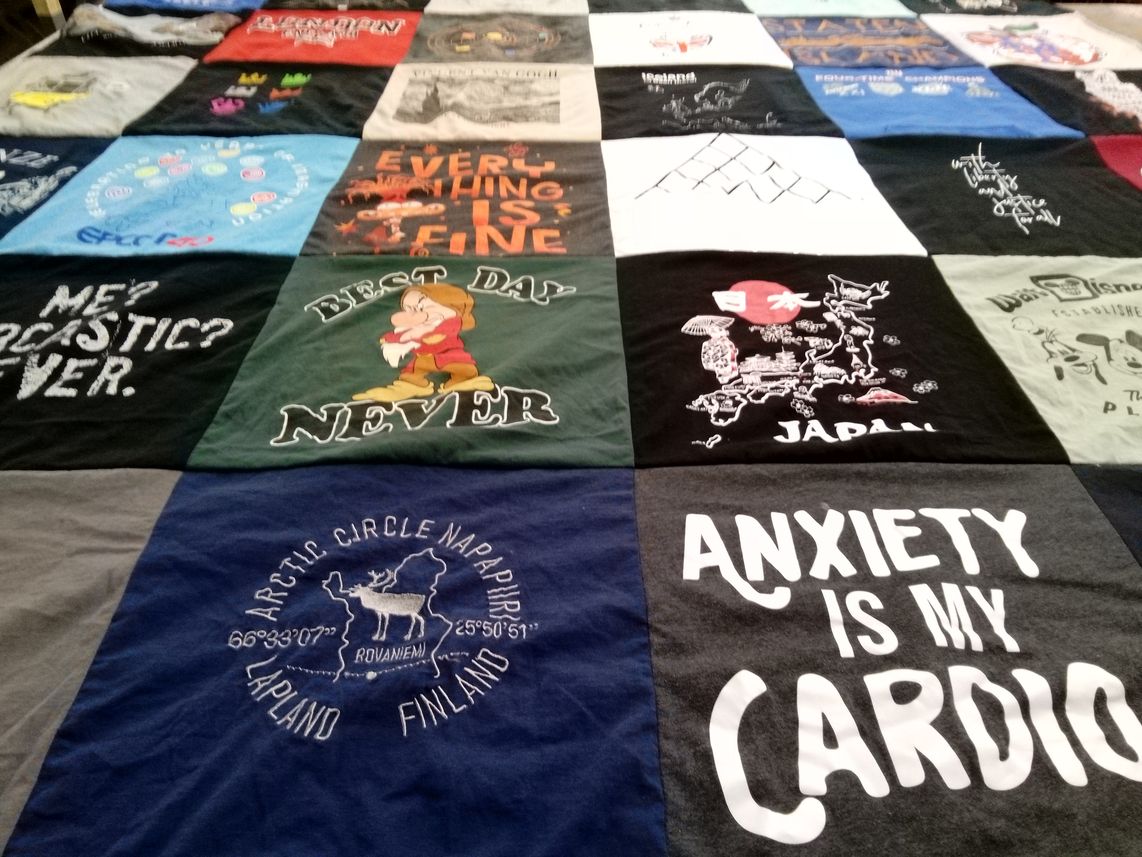 T-shirt quilt with travel, mental health themes by Julia from NY