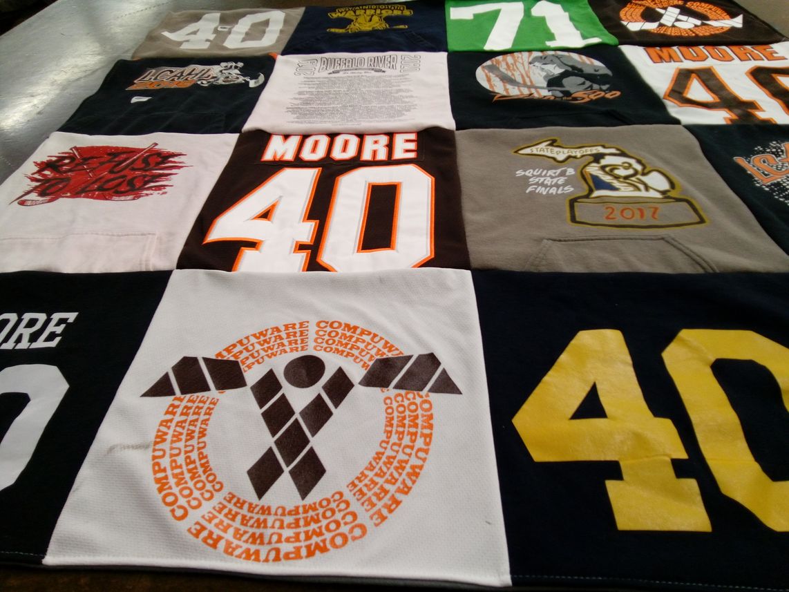T-shirt quilt with sports, hockey themes by Rachel from MI
