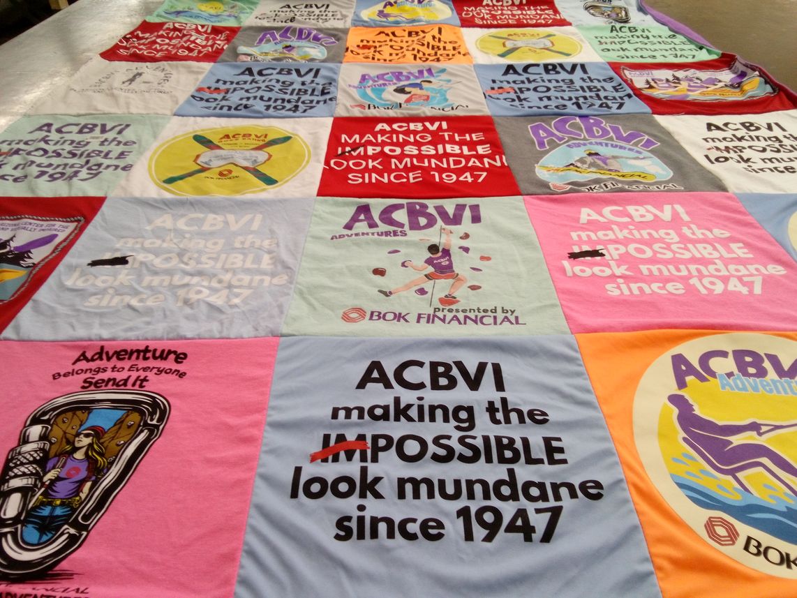 T-shirt quilt with adventure, outdoor activities themes by Kathy from AZ