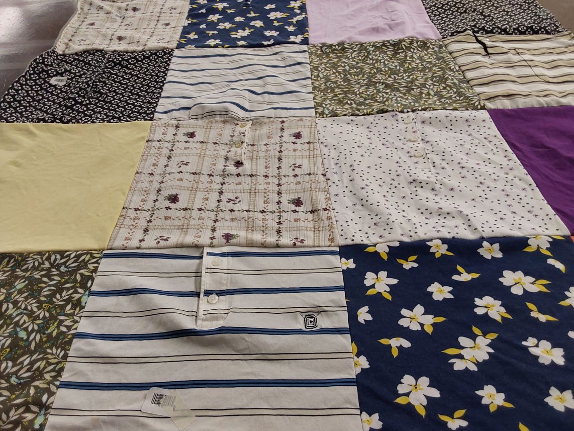T-shirt quilt with quilting, fabric design themes by Sheryl from CA