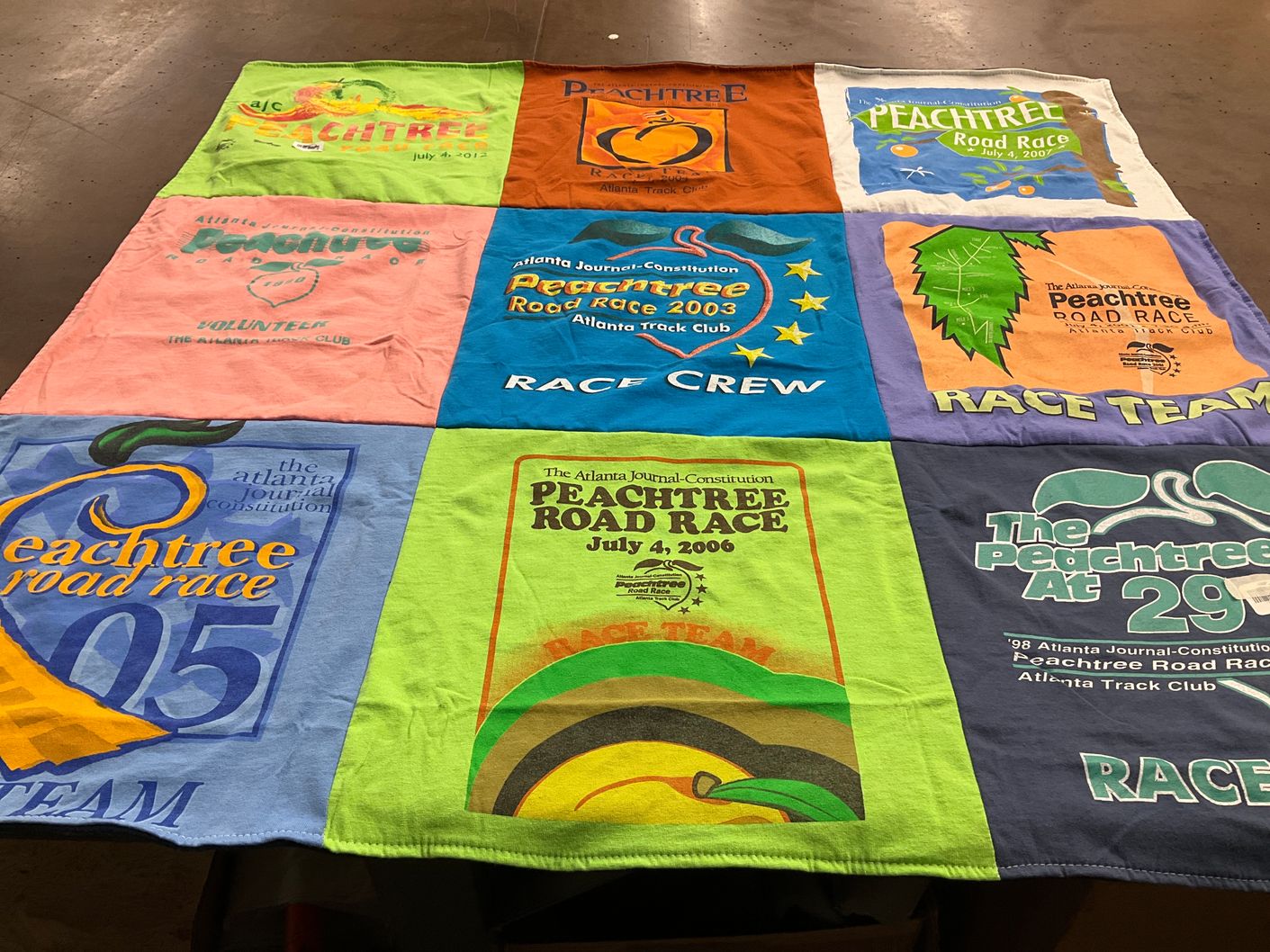 T-shirt quilt with running, charity themes by Jill from GA