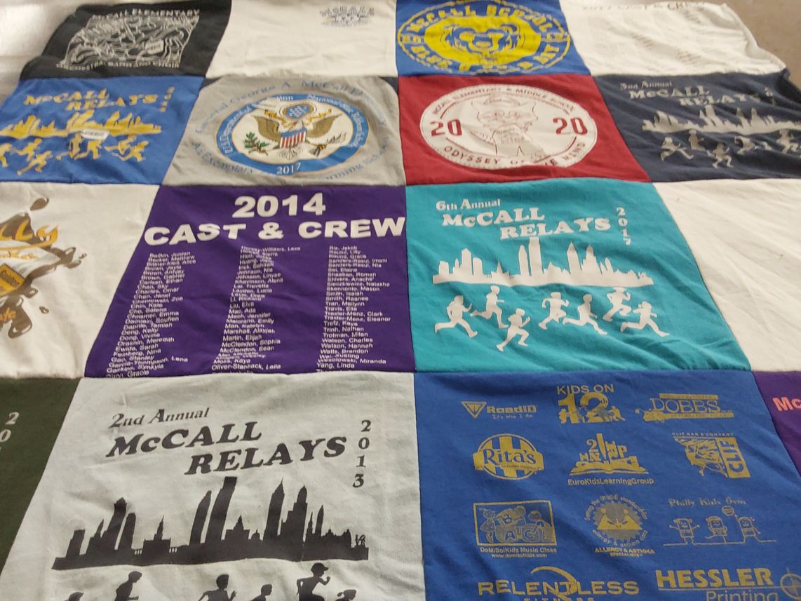 T-shirt quilt with running, theater themes by Marisa from PA
