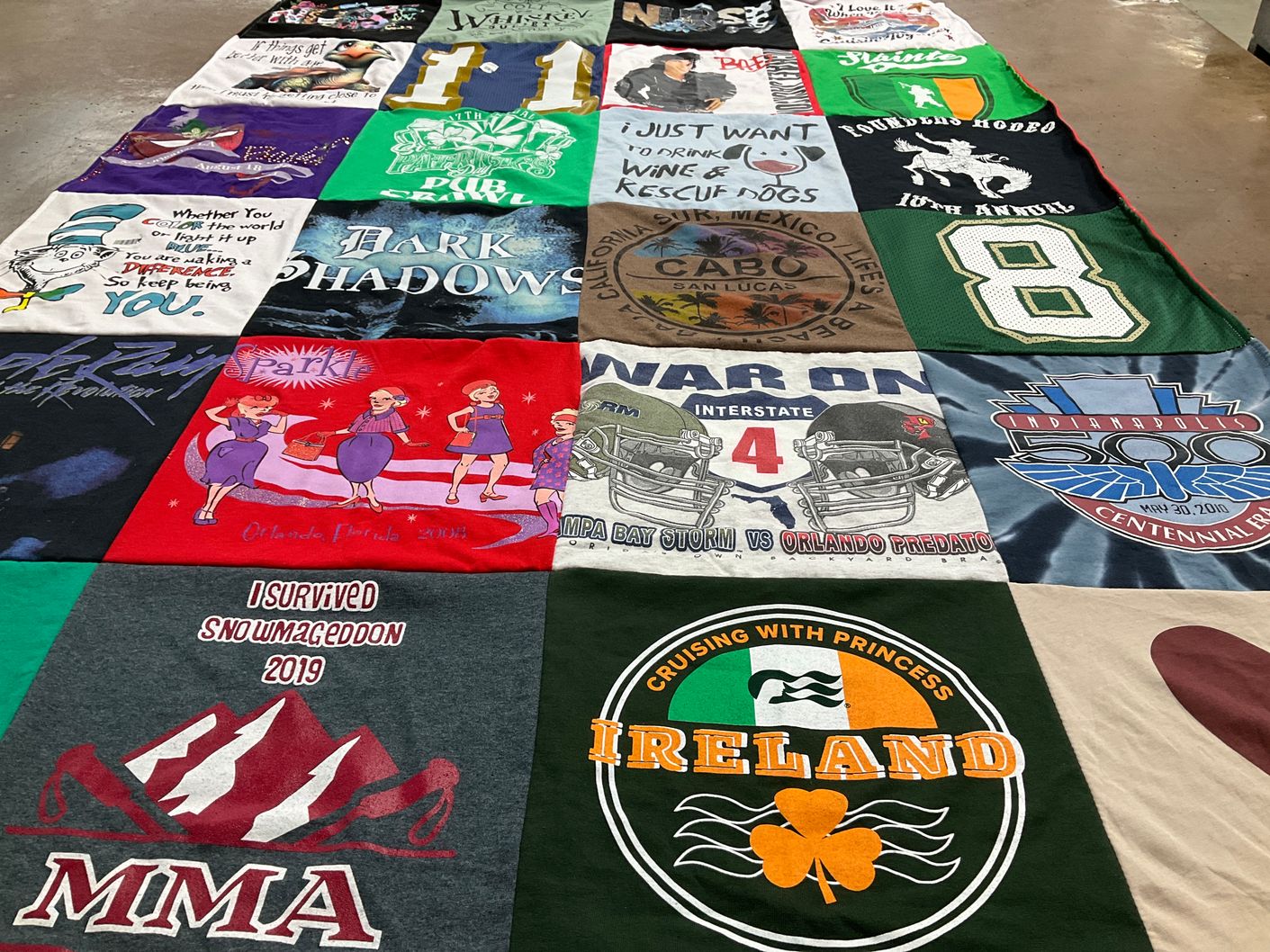 T-shirt quilt with traveling, events themes by Donna from AZ