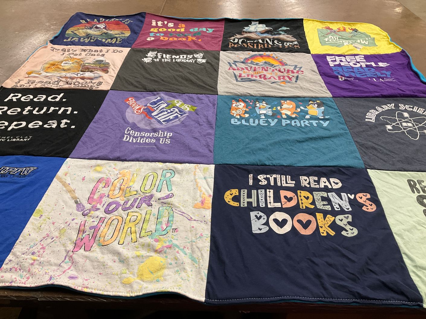 T-shirt quilt with reading, libraries themes by Ellen from IN