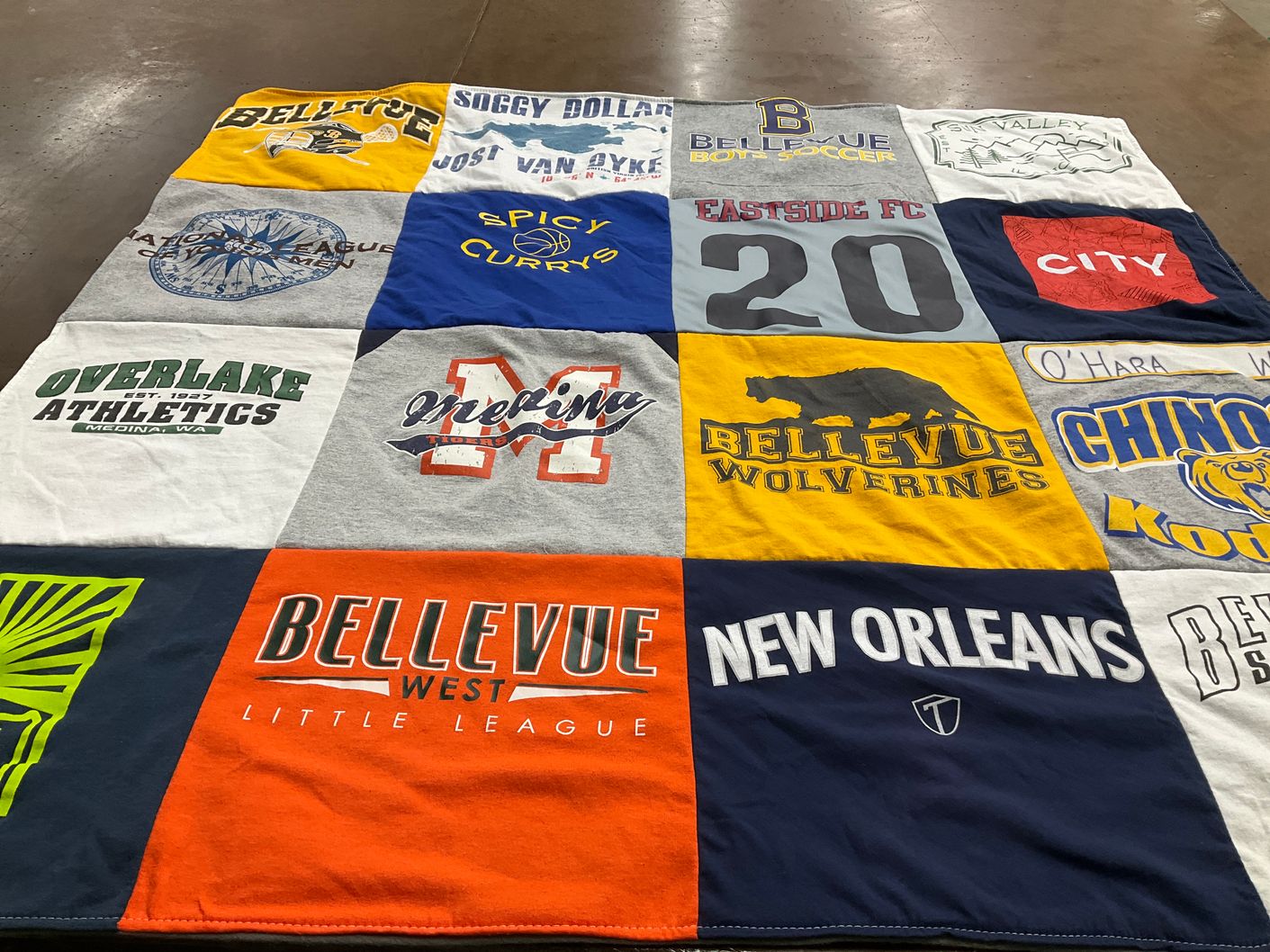 T-shirt quilt featuring bellevue wolverines, chinook kodiaks by Karyn from WA