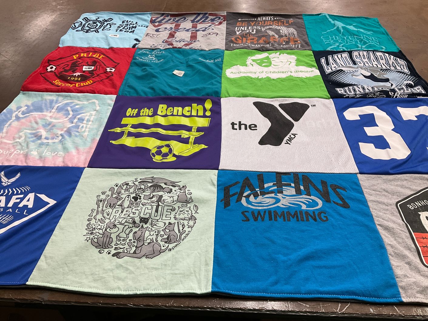 T-shirt quilt featuring falcons swimming, land sharks running club by Shannon from NC