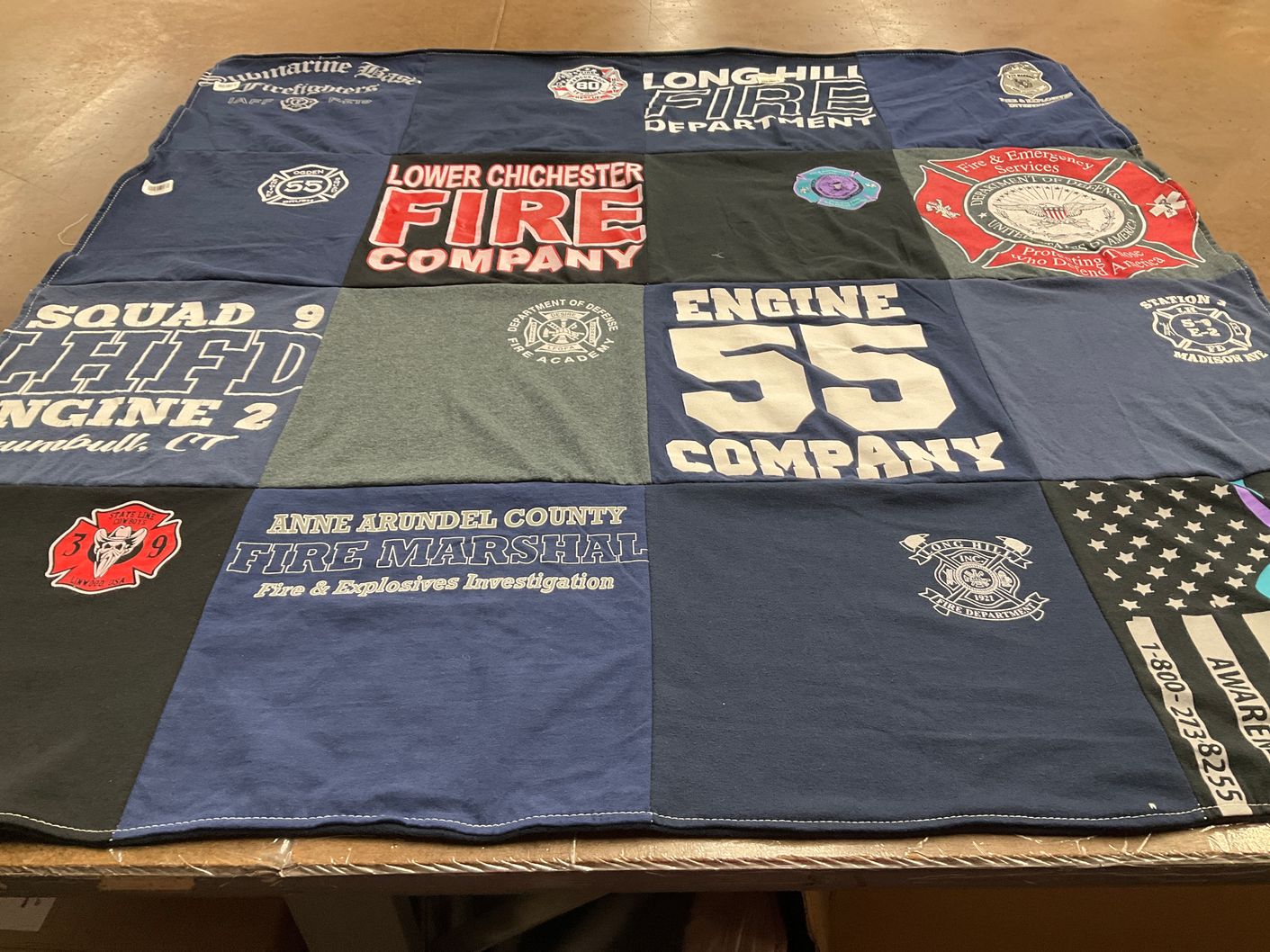 T-shirt quilt with firefighting, public safety themes by Haley from CT