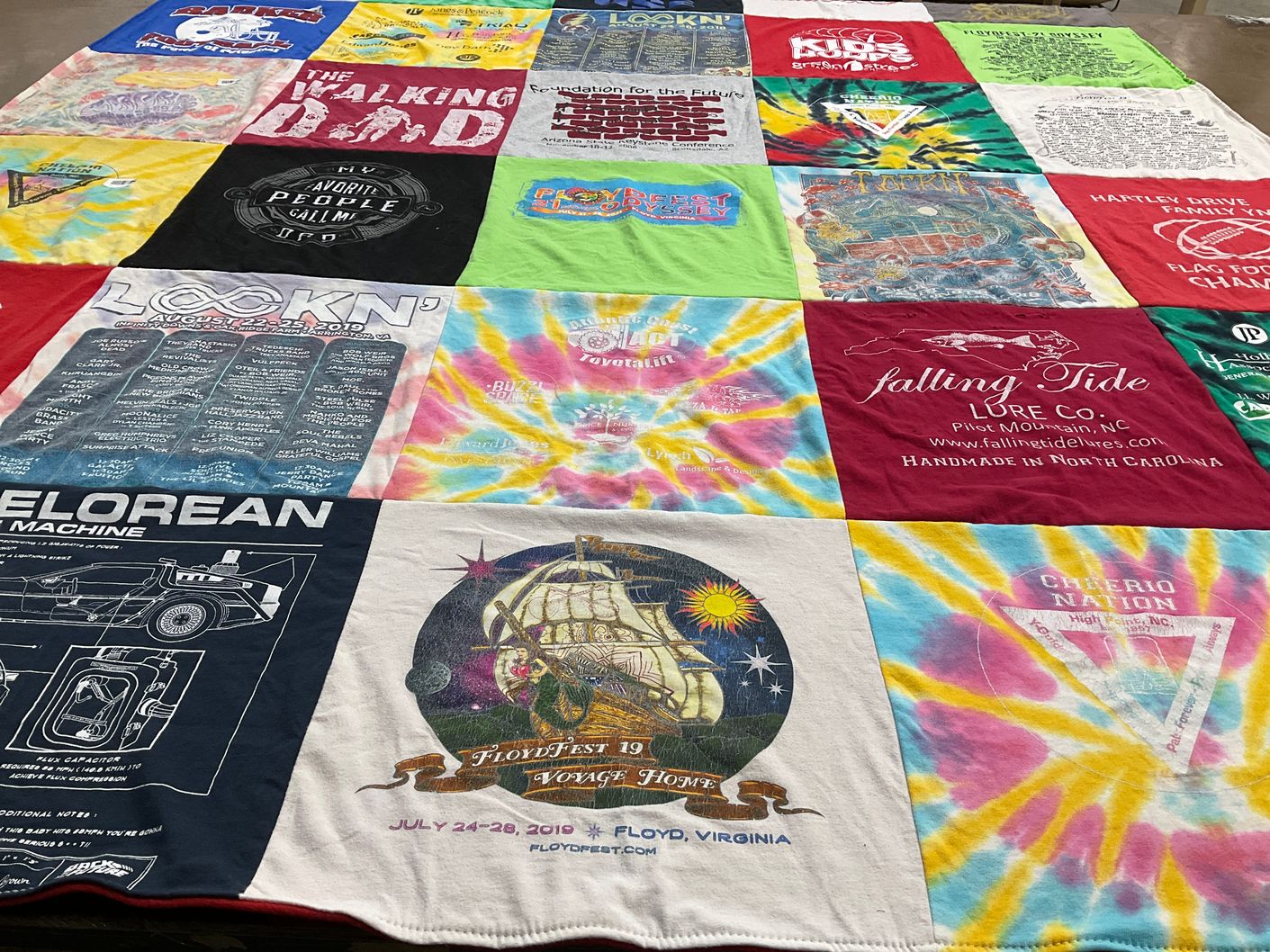 T-shirt quilt with music festivals, hiking themes by Courtney from WY