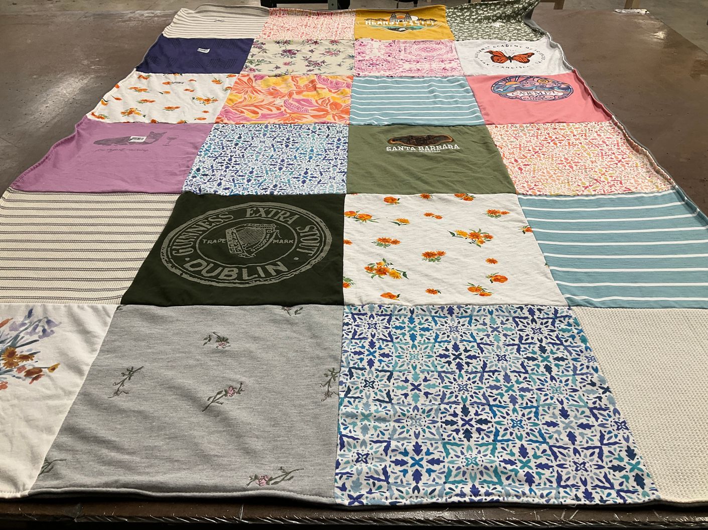 T-shirt quilt with travel, drinks themes by Liliana from CA