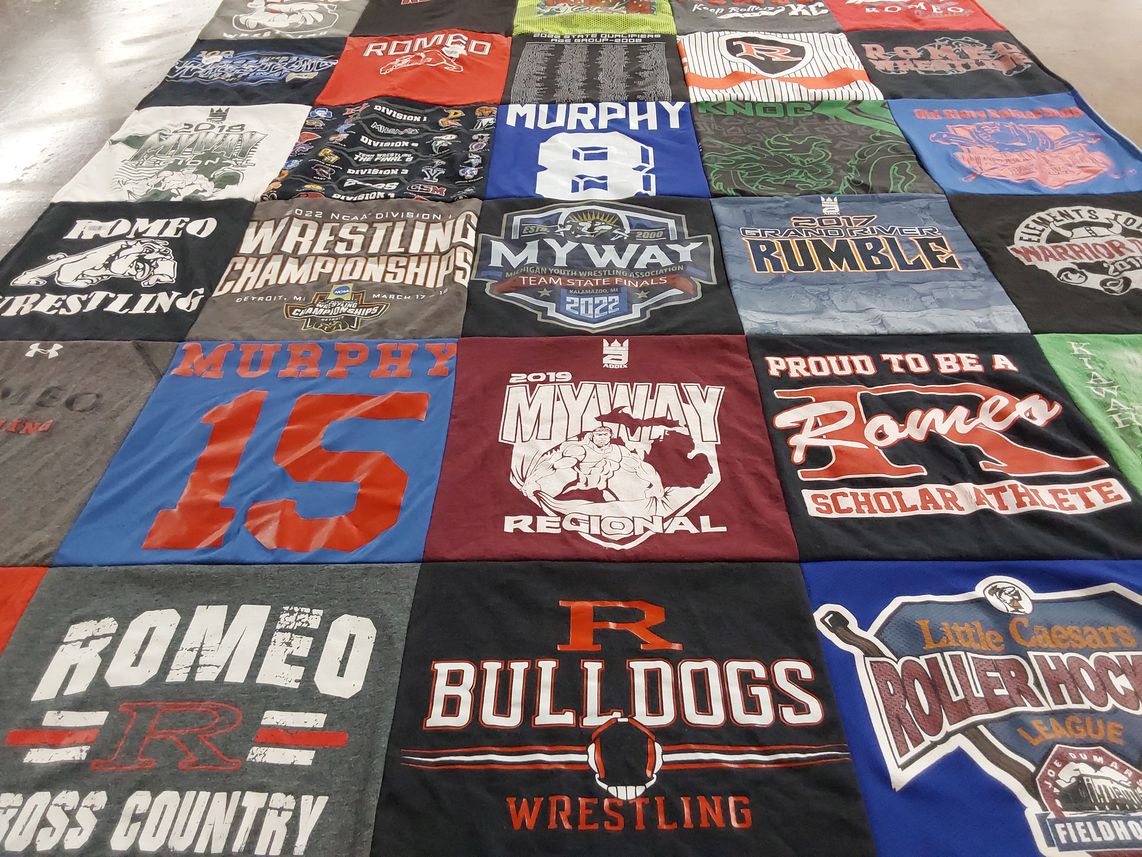 T-shirt quilt featuring romeo bulldogs wrestling by Mary from MI