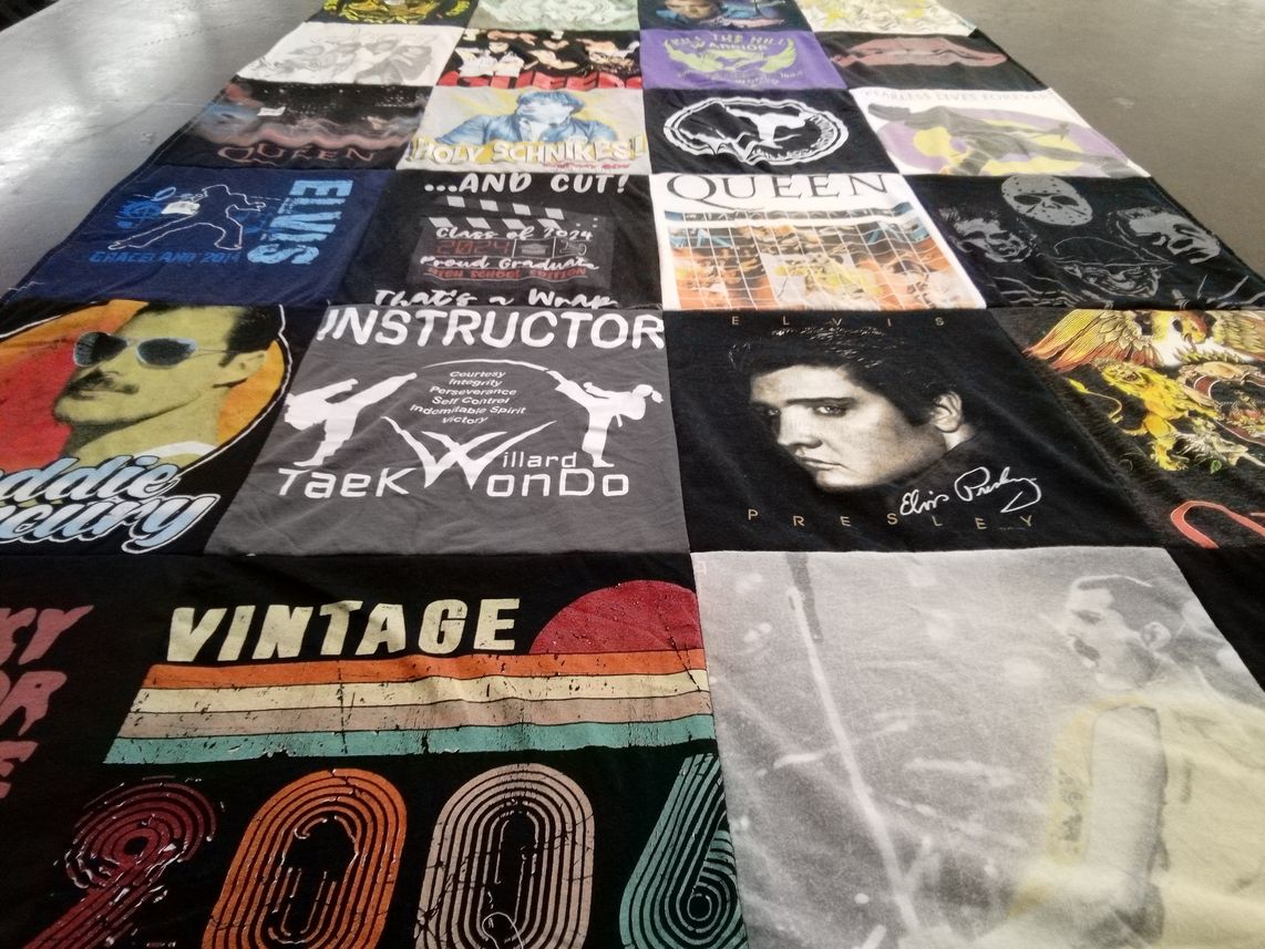 T-shirt quilt with music, pop culture themes by Beth from MO