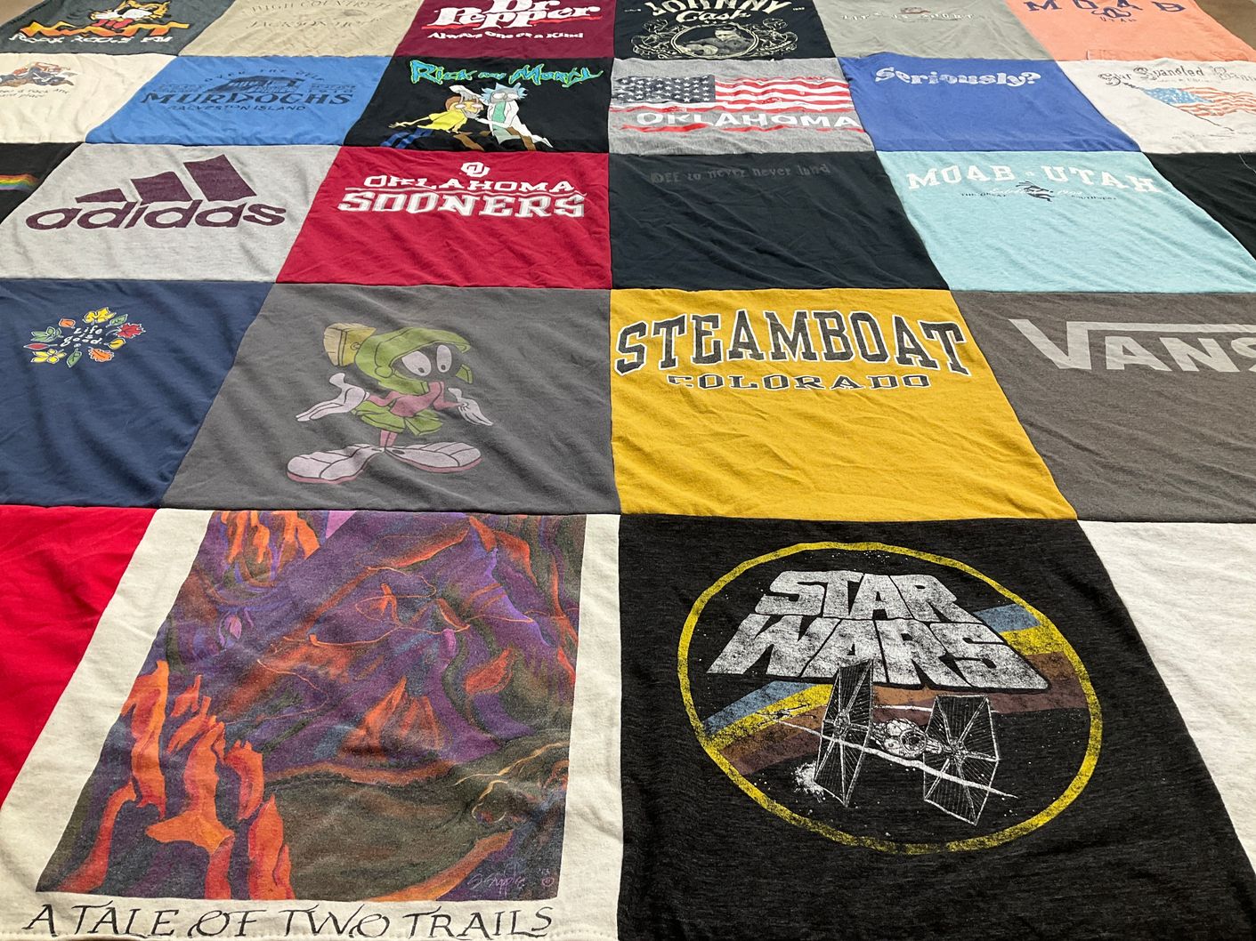 T-shirt quilt from university of oklahoma, steamboat springs high school by Linda from CO