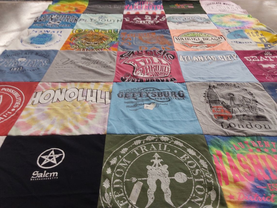 T-shirt quilt with travel, tourism themes by Lori from NE
