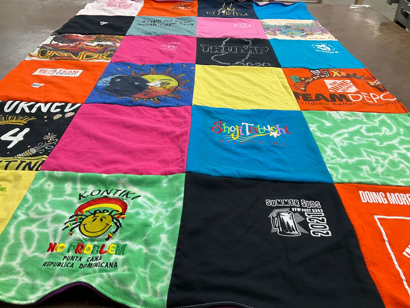 T-shirt quilt with travel, community service themes by Anne Marie from NJ