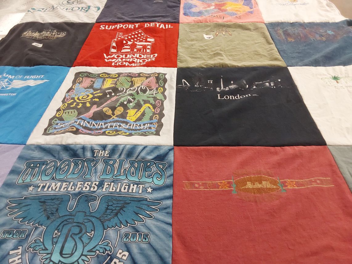 T-shirt quilt with travel, music themes by Nancy from AZ