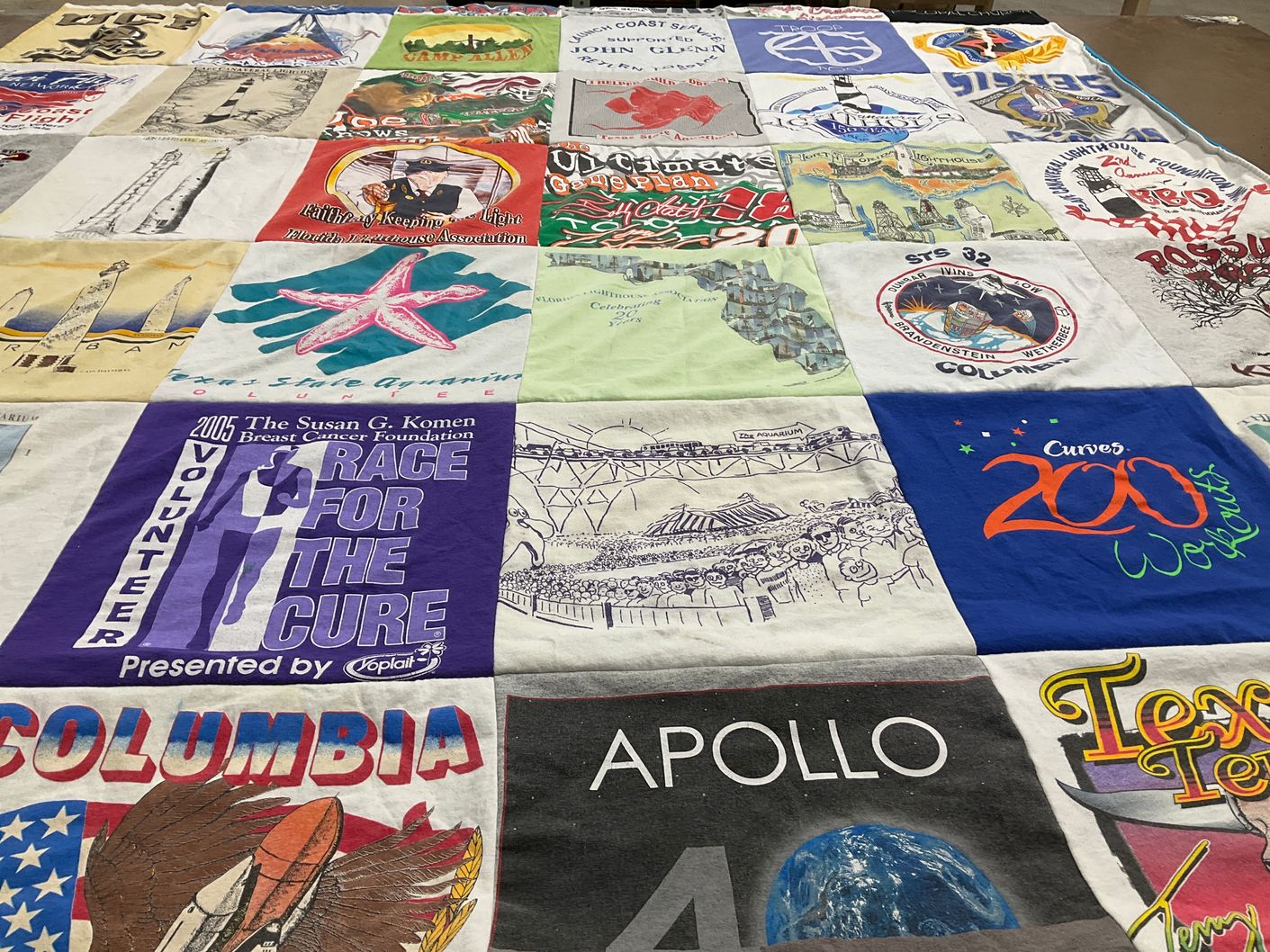 T-shirt quilt with breast cancer awareness, fitness themes by Ginny from FL