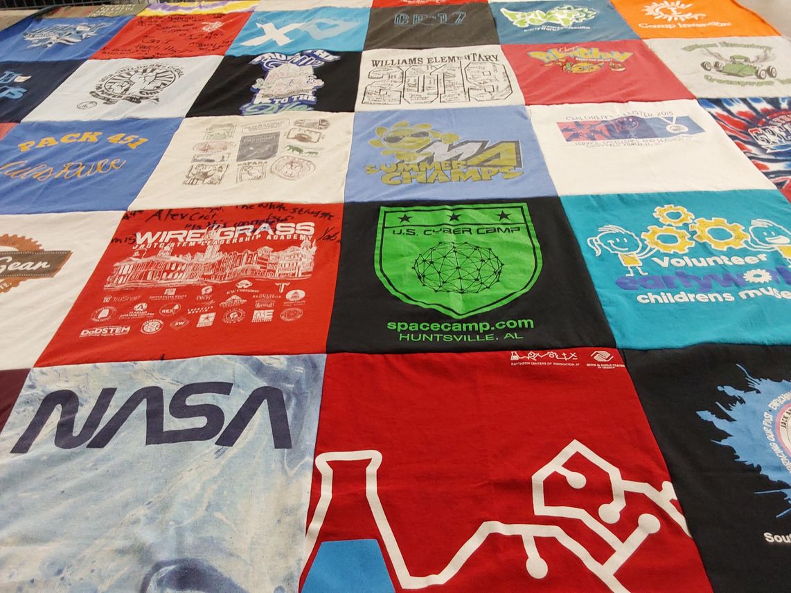 T-shirt quilt with science, technology themes by Quaynteece from AL