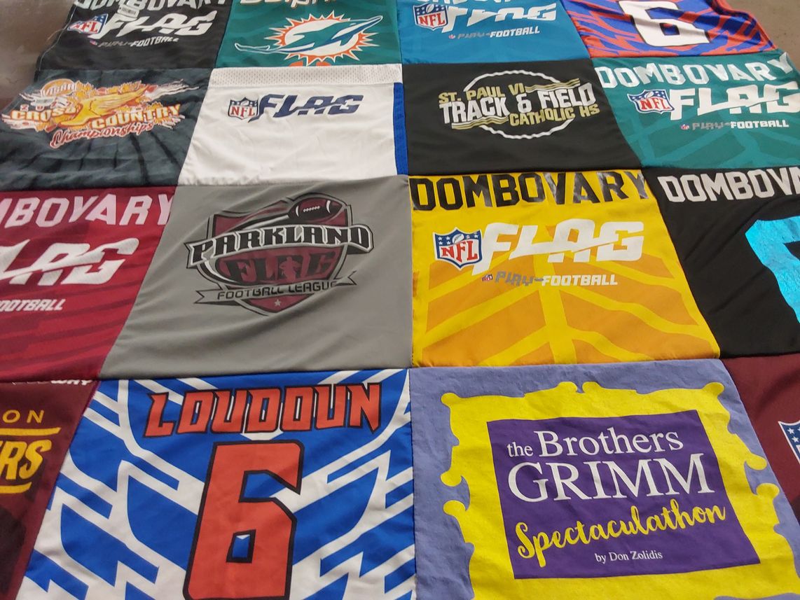 T-shirt quilt with football, theater themes by Sarah from TX