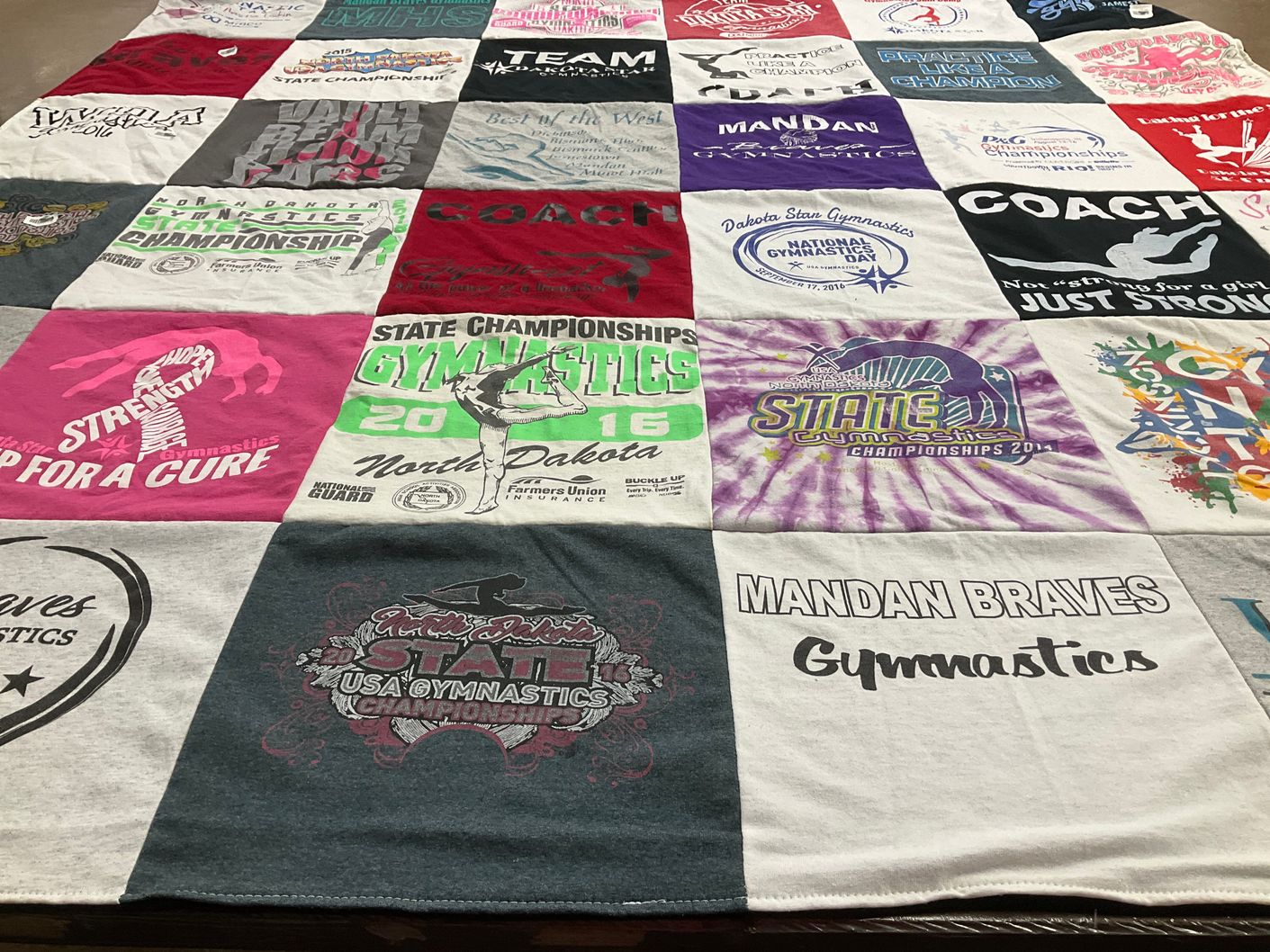 T-shirt quilt featuring mandan braves gymnastics by Brigitte from ND