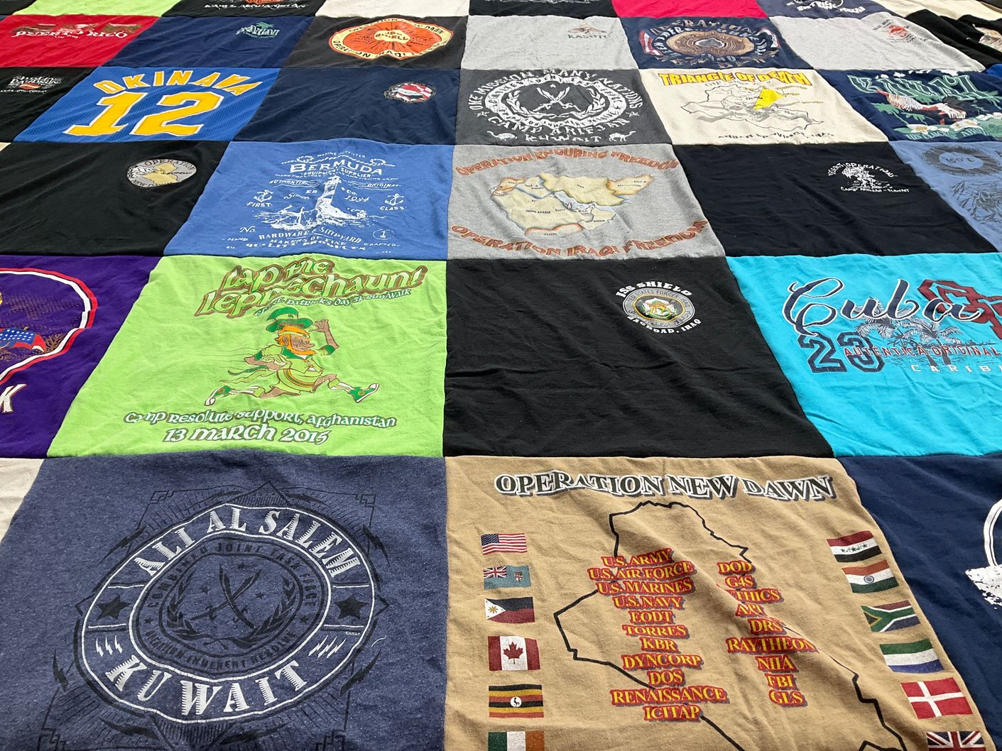 T-shirt quilt with military, travel themes by Karen from VA