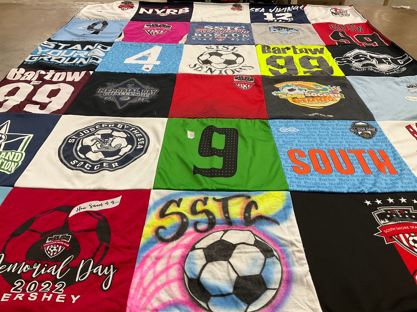 T-shirt quilt with soccer themes by Harlee from NY