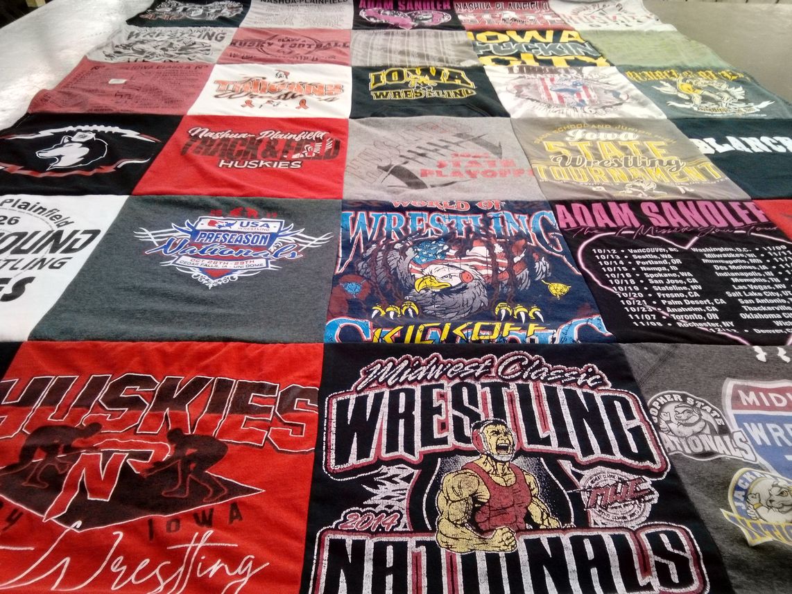 T-shirt quilt featuring nathan plainfield huskies wrestling by Sheena from IA