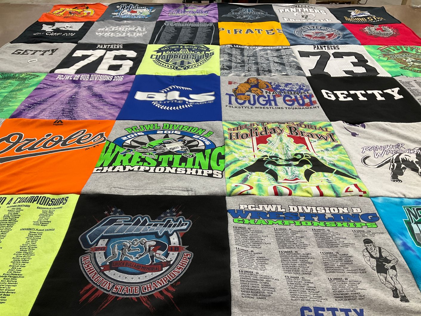 T-shirt quilt with wrestling themes by Kate from WA