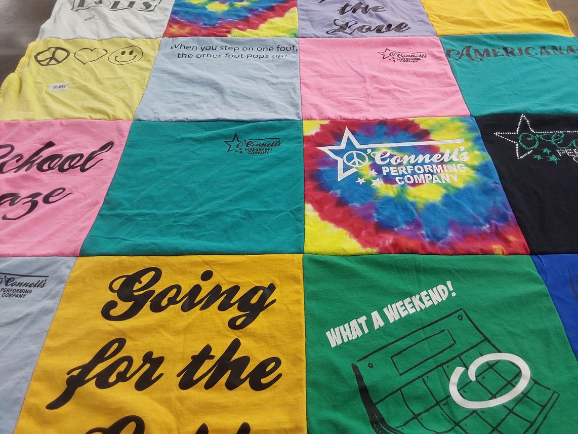 T-shirt quilt with performing arts themes by Laura from IL
