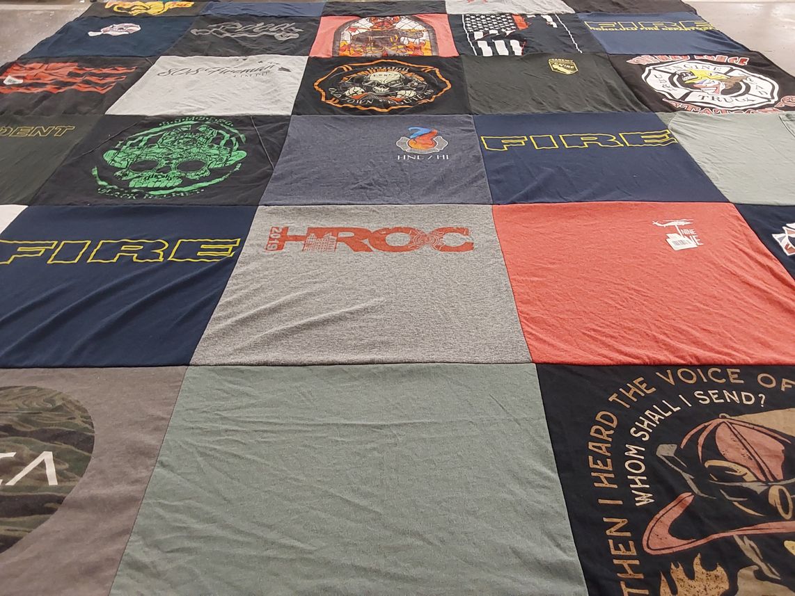 T-shirt quilt with firefighting, emergency services themes by Claire from HI