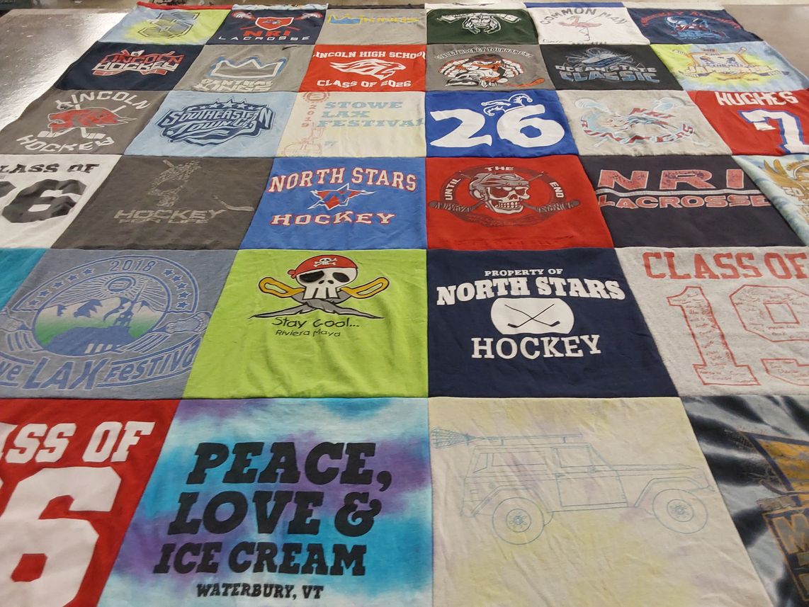 T-shirt quilt featuring north stars hockey by judy from RI