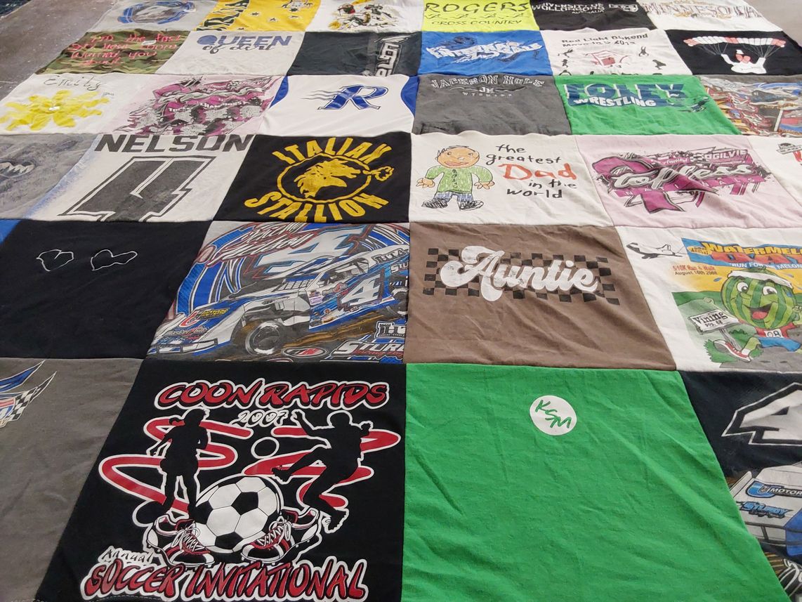 T-shirt quilt with soccer, wrestling themes by Emily from MN