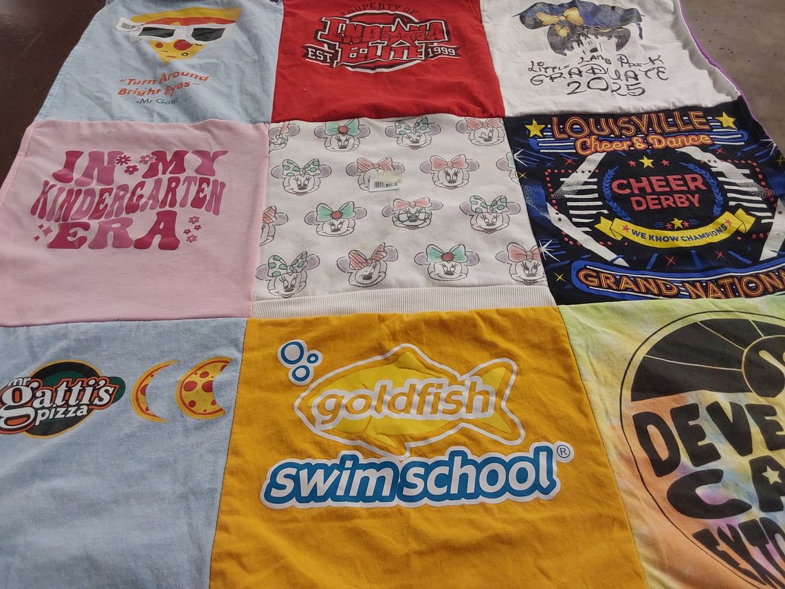 T-shirt quilt with cheerleading, swimming themes by Mariah from IN