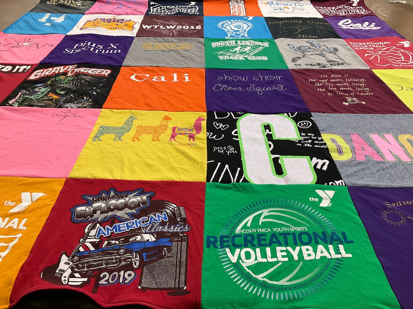 T-shirt quilt with sports, dance themes by Anna from NE