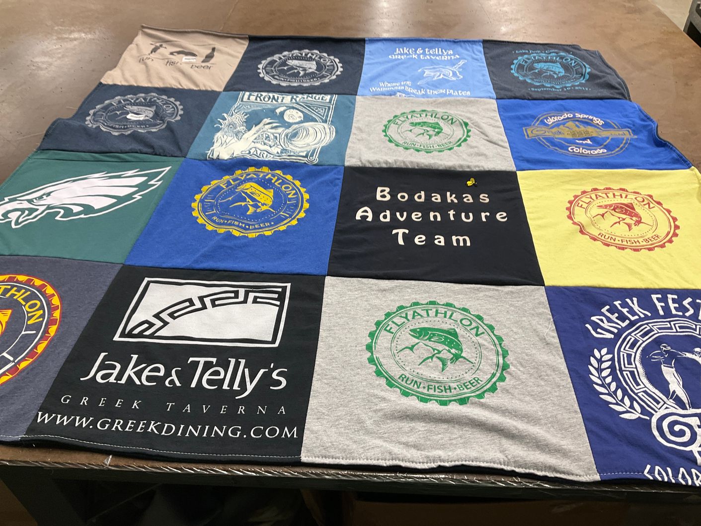 T-shirt quilt with outdoor activities, greek cuisine themes by Angie from CO