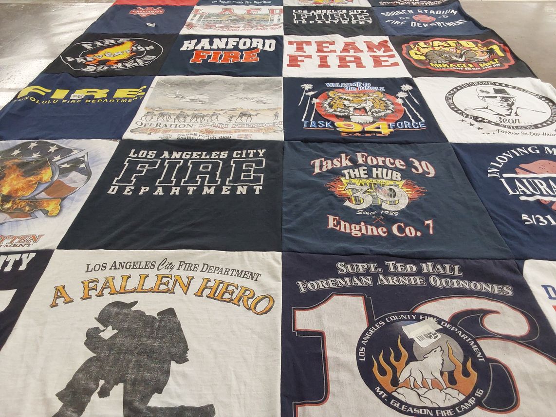 T-shirt quilt with firefighting, community service themes by Renee from CA