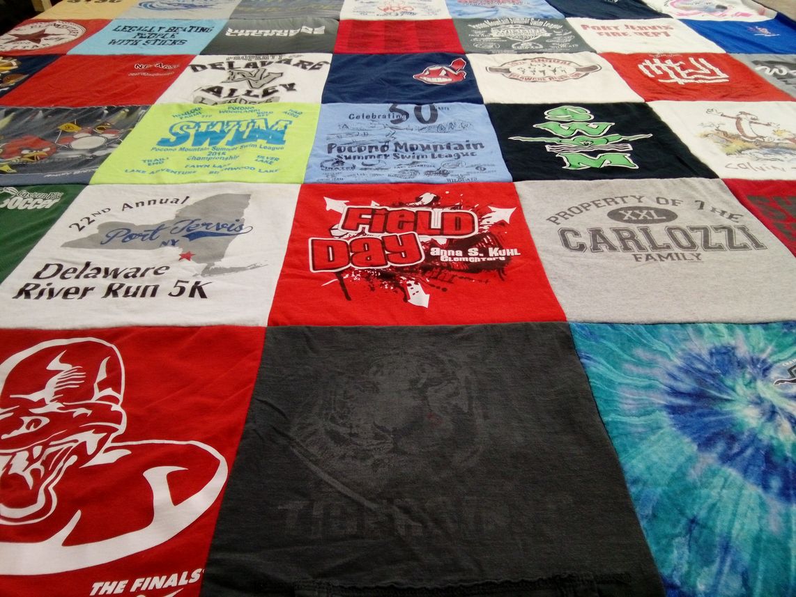 T-shirt quilt with running, swimming themes by Ryan from PA