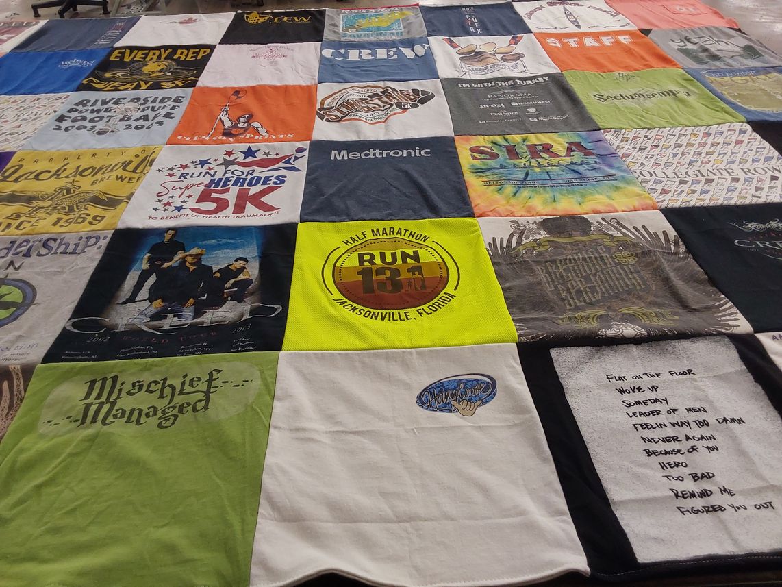 T-shirt quilt with running, charity themes by Devin from CO