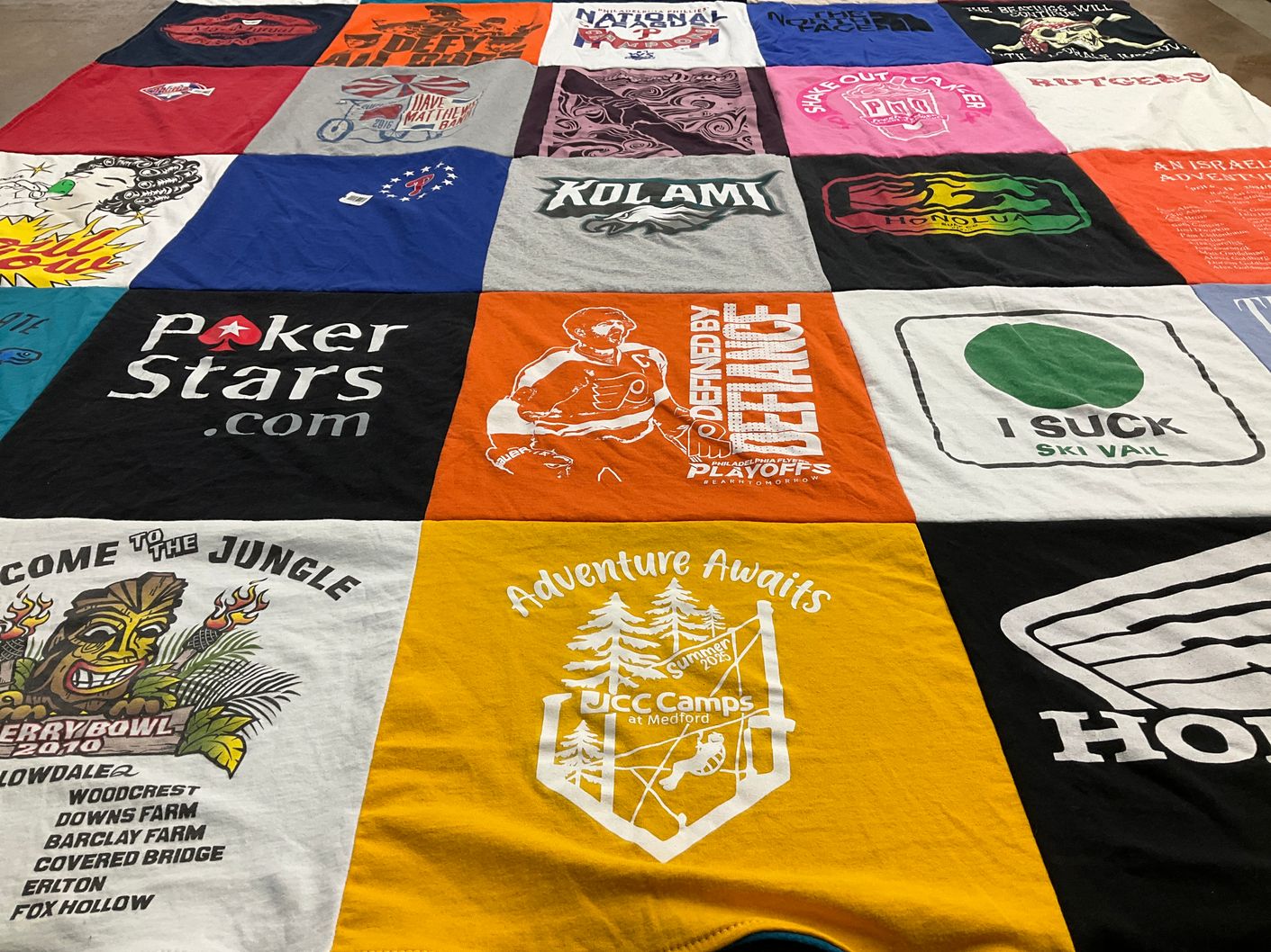 T-shirt quilt with skiing, outdoors themes by Faye from NJ